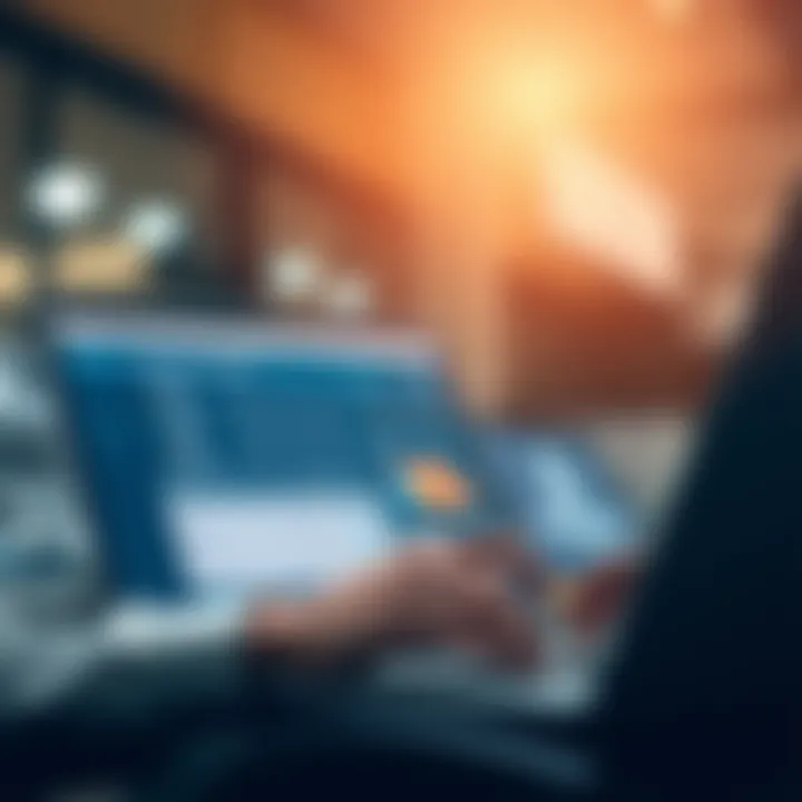Harnessing Technology for Invoicing An individual utilizing invoicing software on a laptop.
