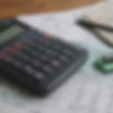 A calculator and tax forms on a desk